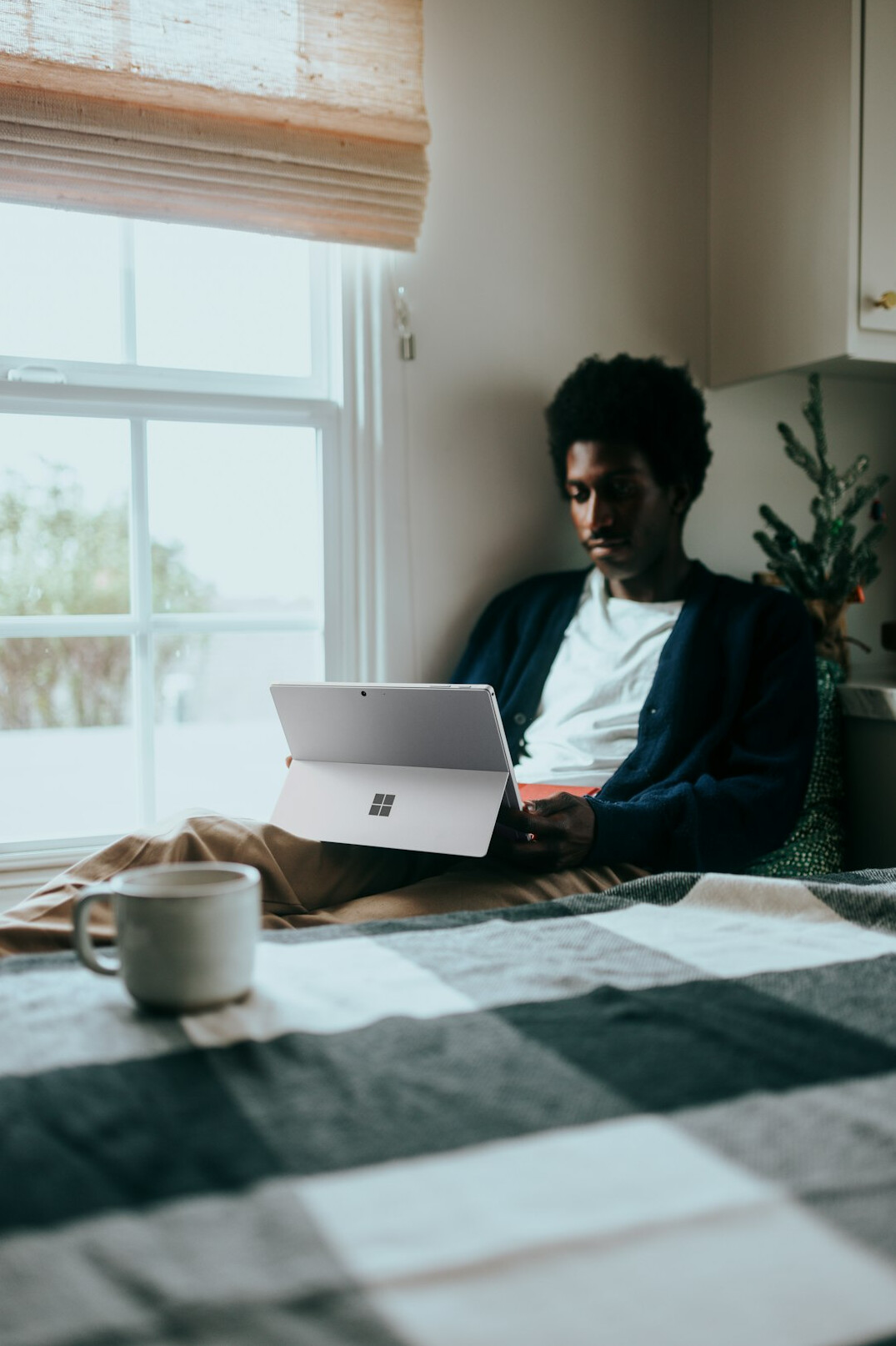 person coding on laptop at home