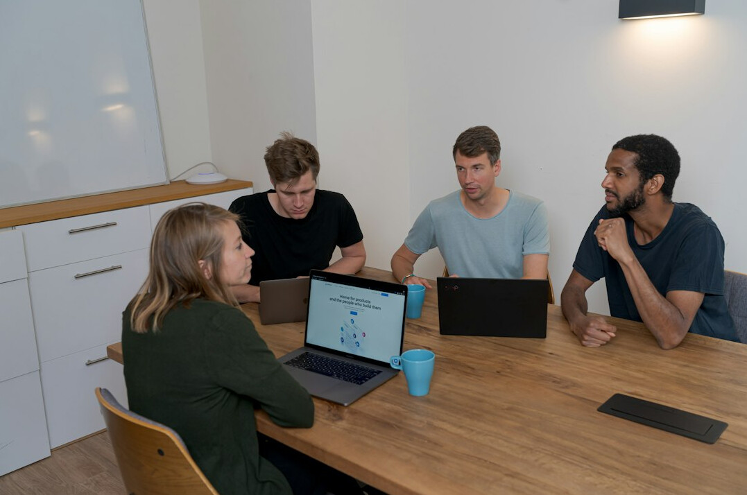 diverse team collaborating on code