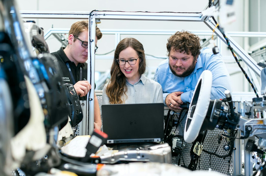diverse group in coding workshop